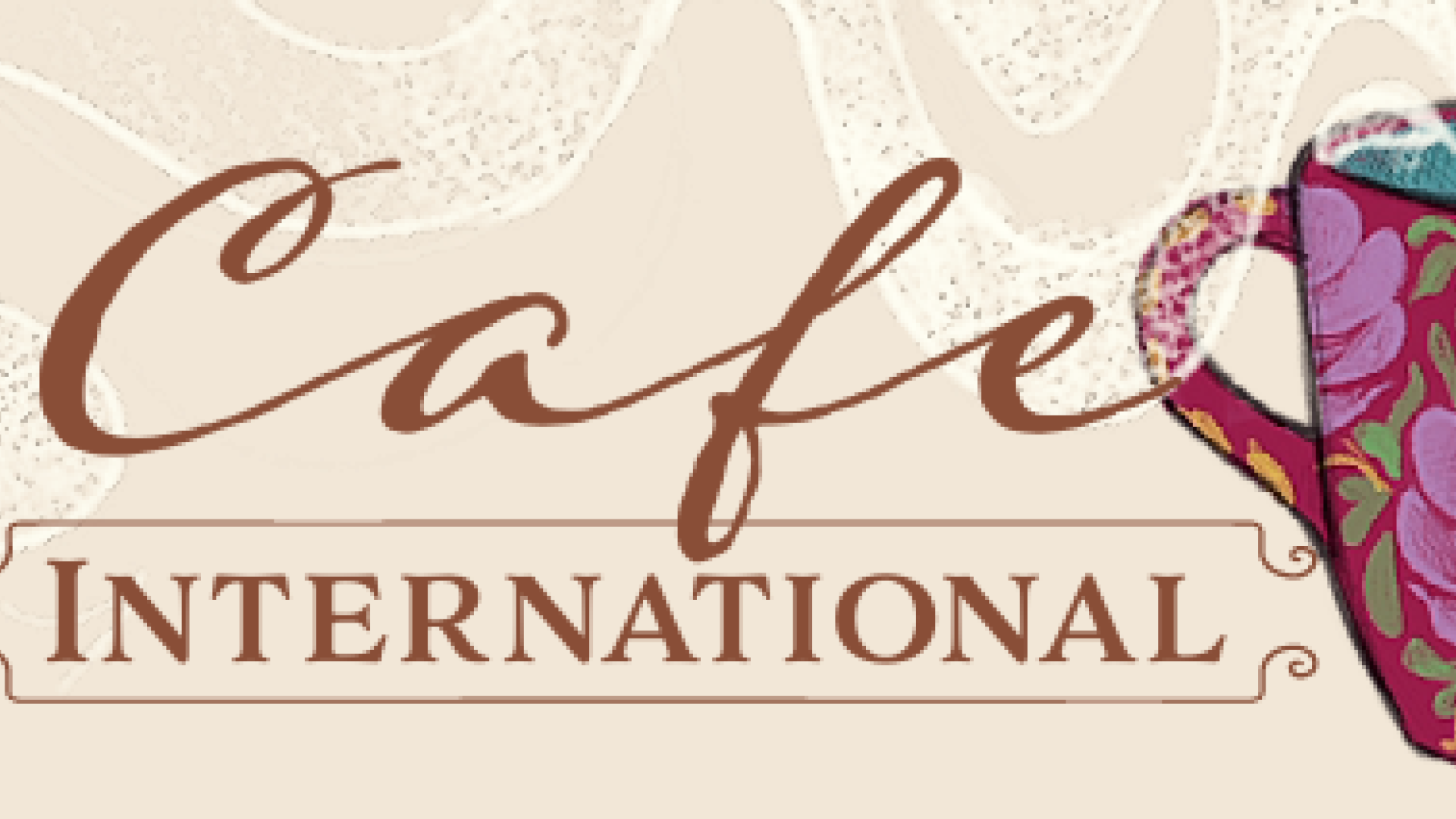 Beige background with "Cafe" in a cursive font above "International" next to a red coffee mug with flower designs on it where the steam flows across the banner