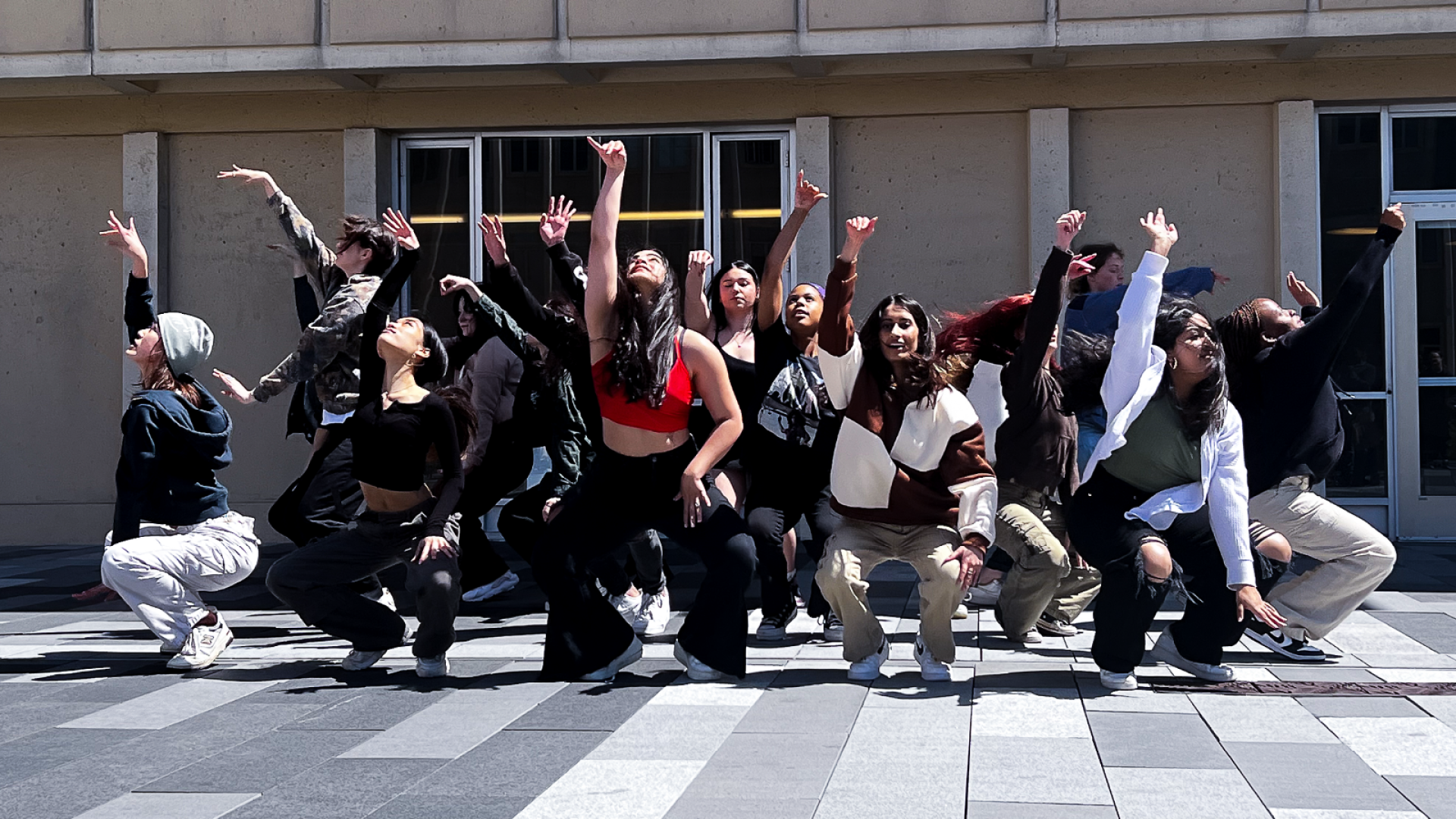 student dancers performing in front of Gleeson Library