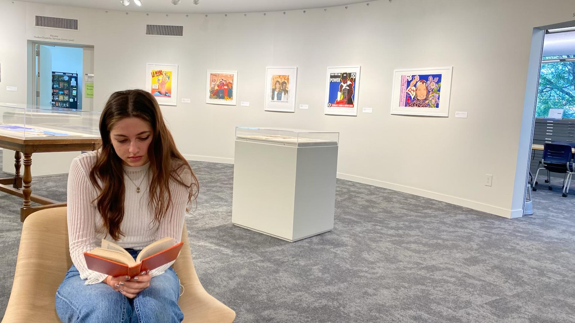Thacher Gallery Assistant reading in the gallery