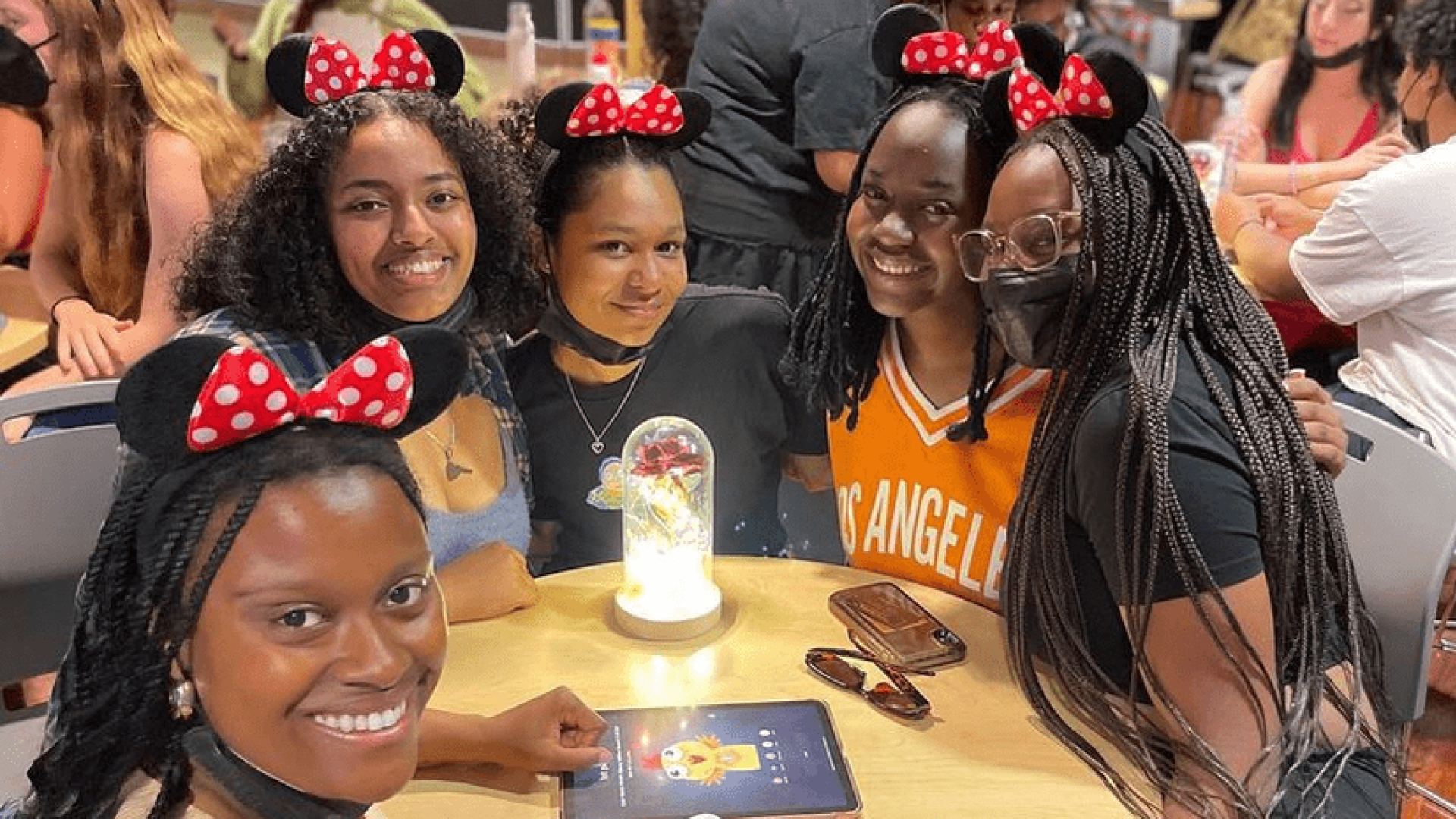 A group of girls smiling at the camera for a group photo