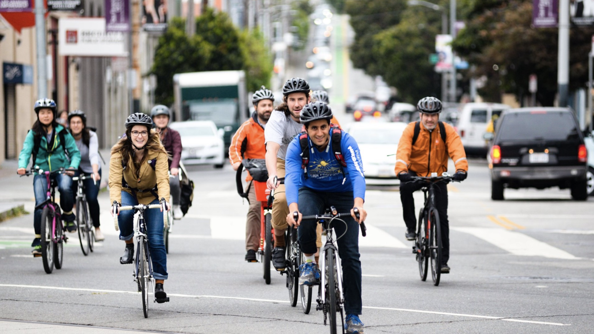 commuters biking through street intersection