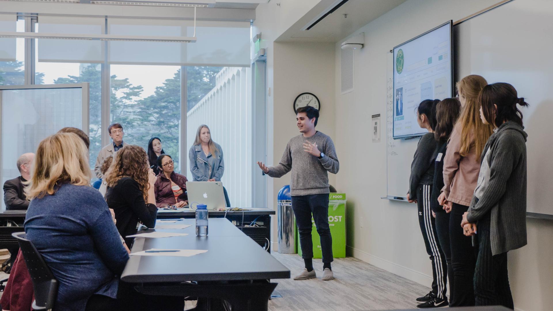 Students presenting their proposal to an audience at the 2018 USF Sustainability Design Challenge