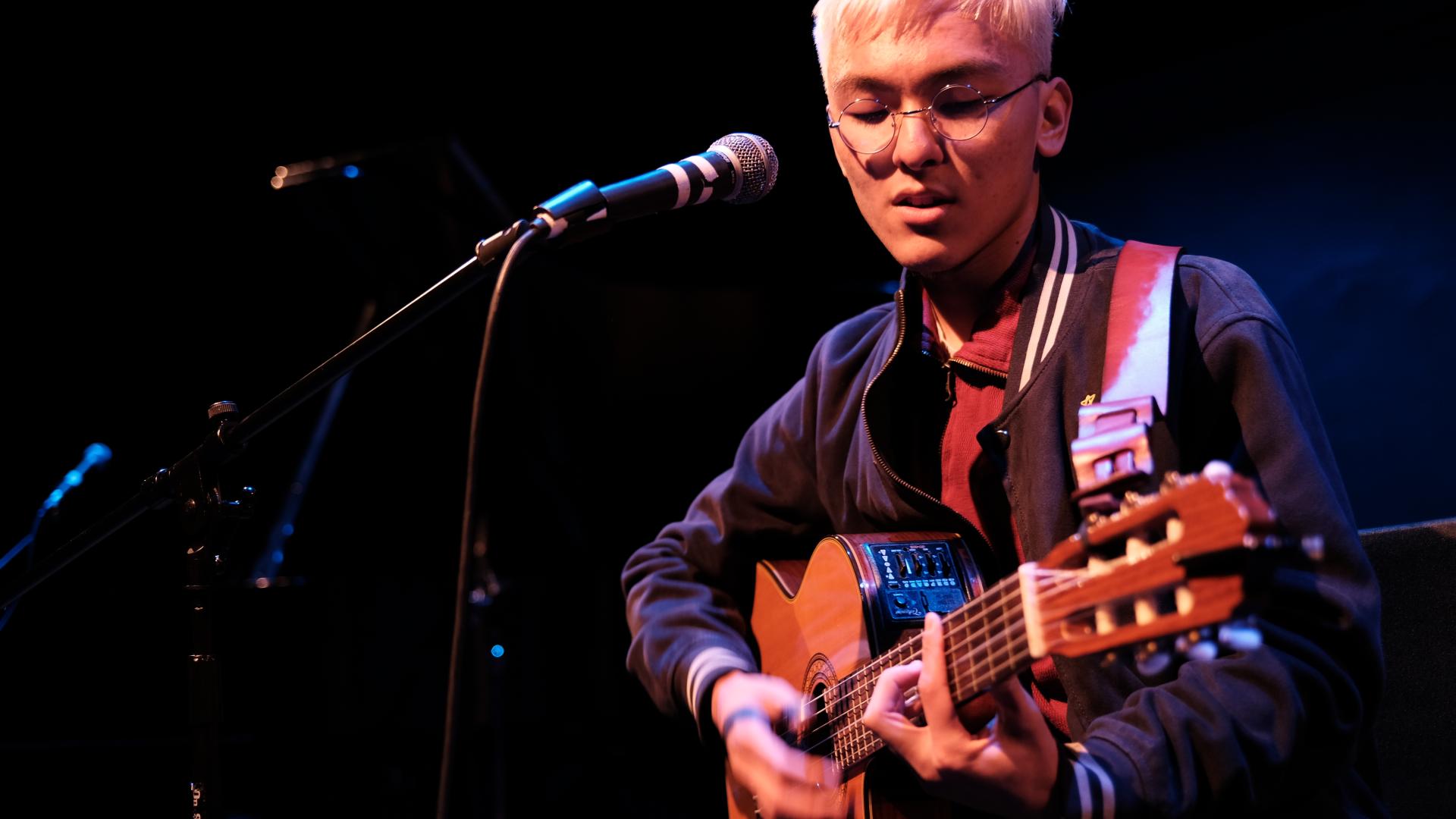 student playing guitar