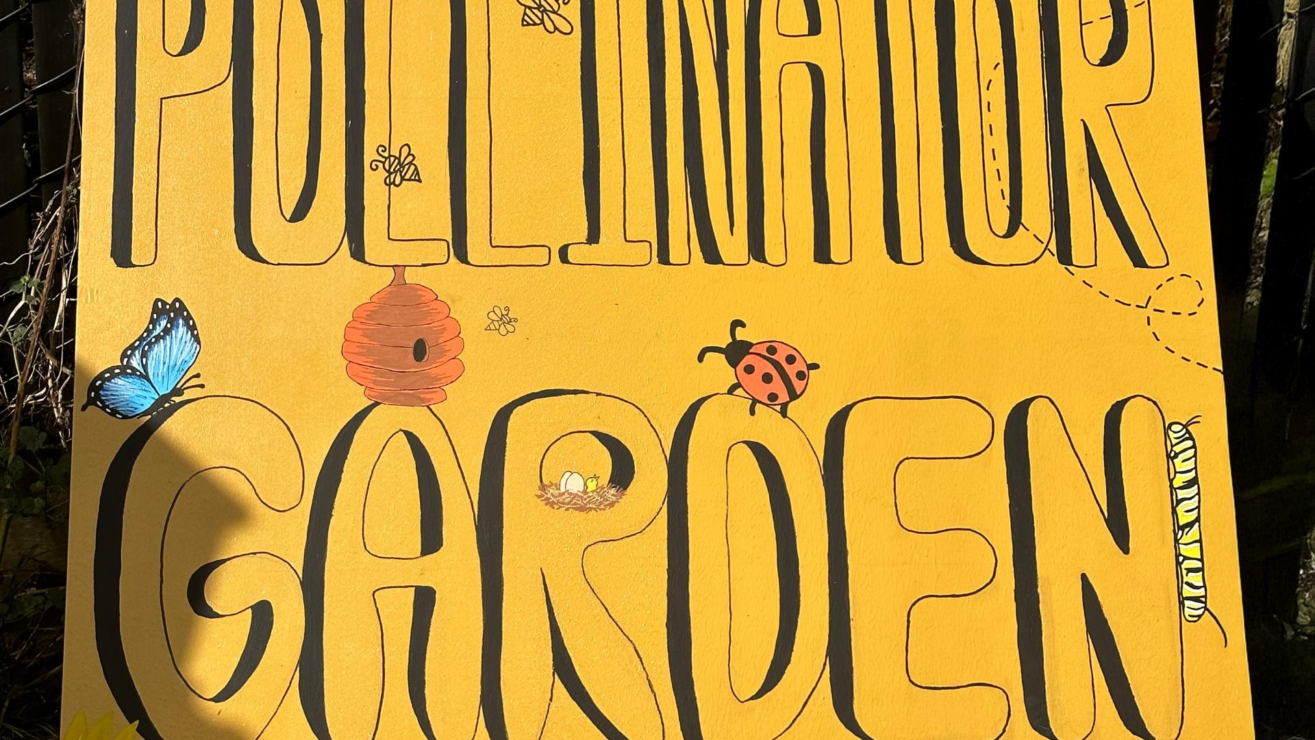 &quot;Coming soon: pollinator garden&quot; signage