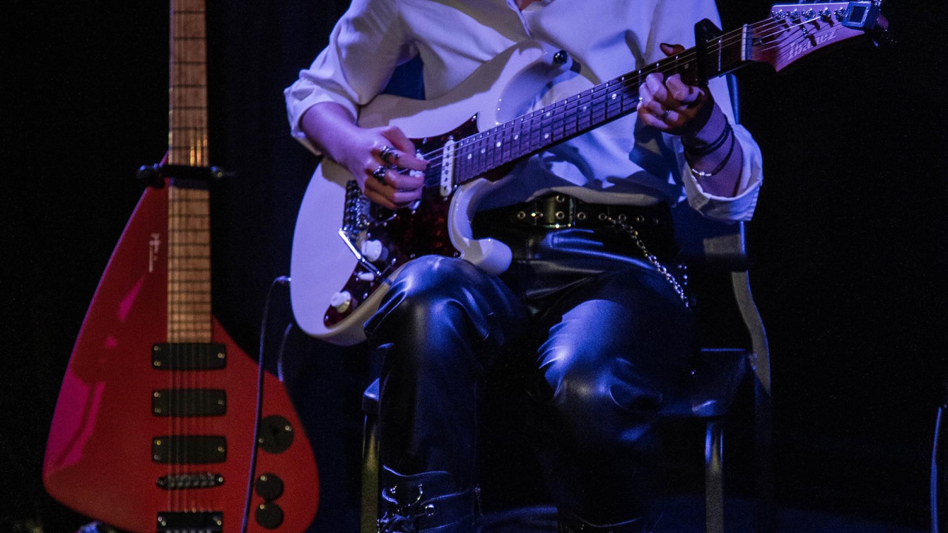Student playing guitar