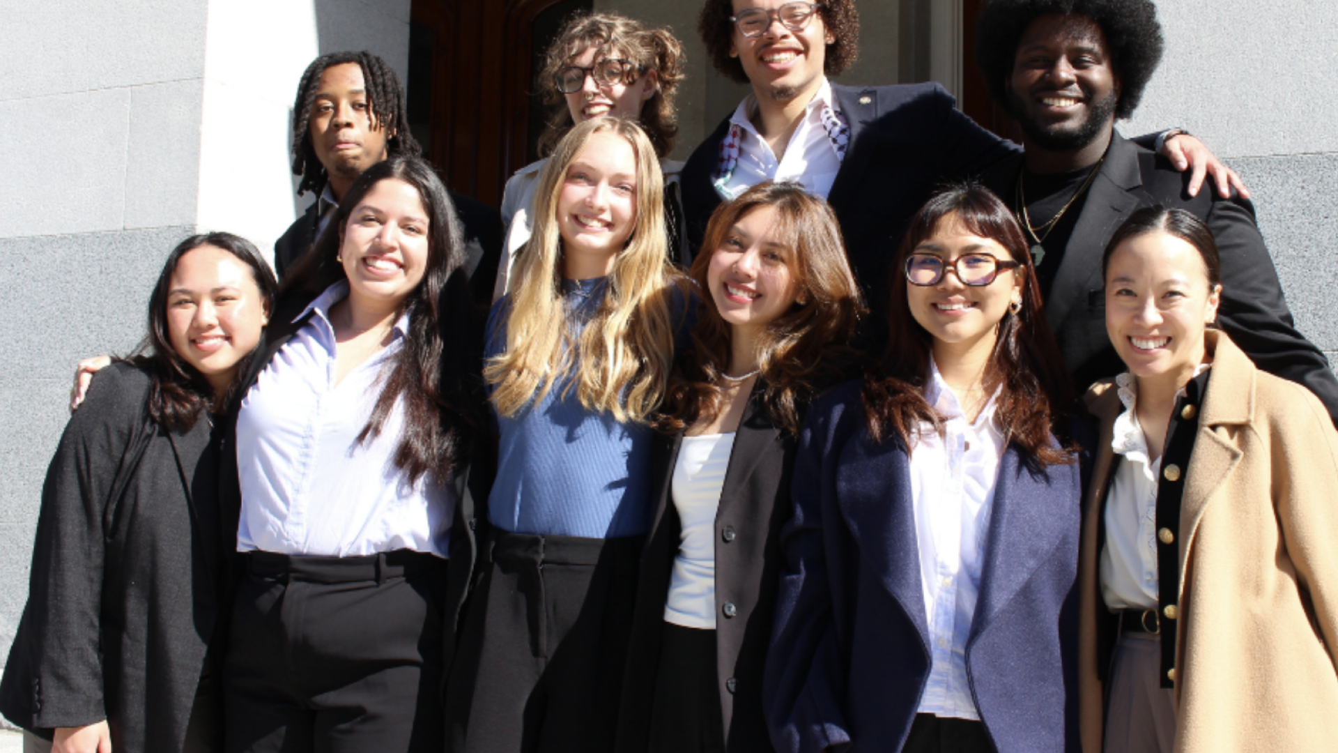 Students standing together smiling