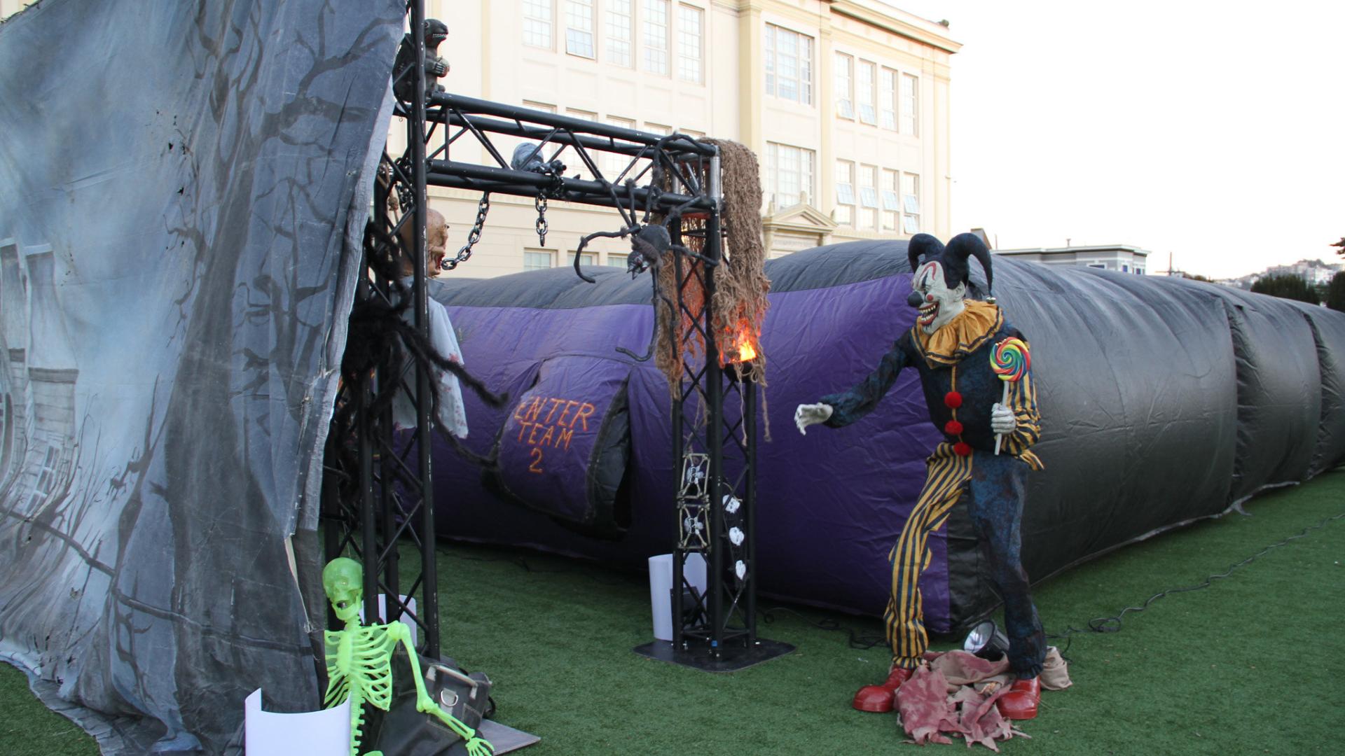 Scary clown with haunted house