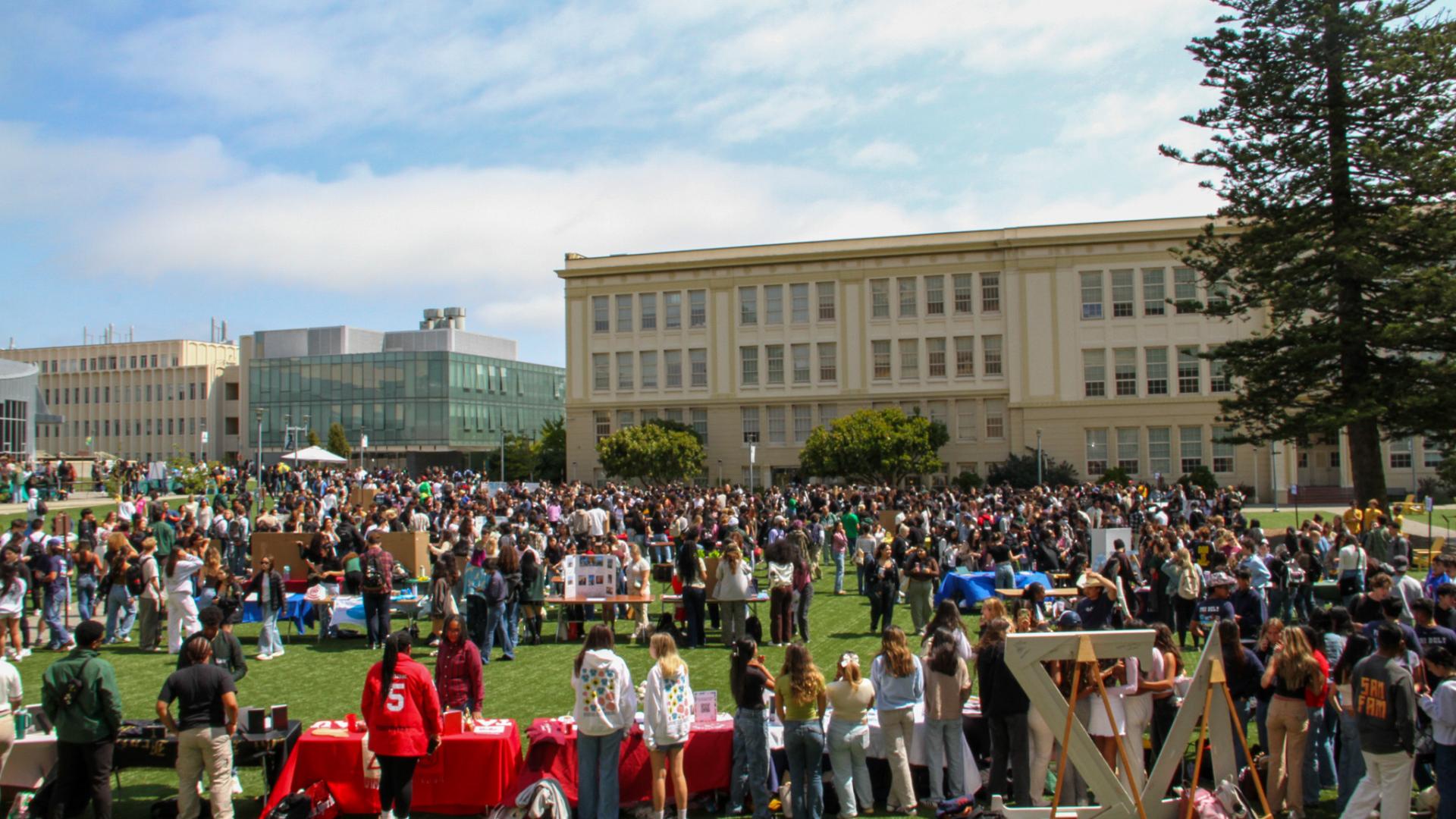 Students gathered around tables.