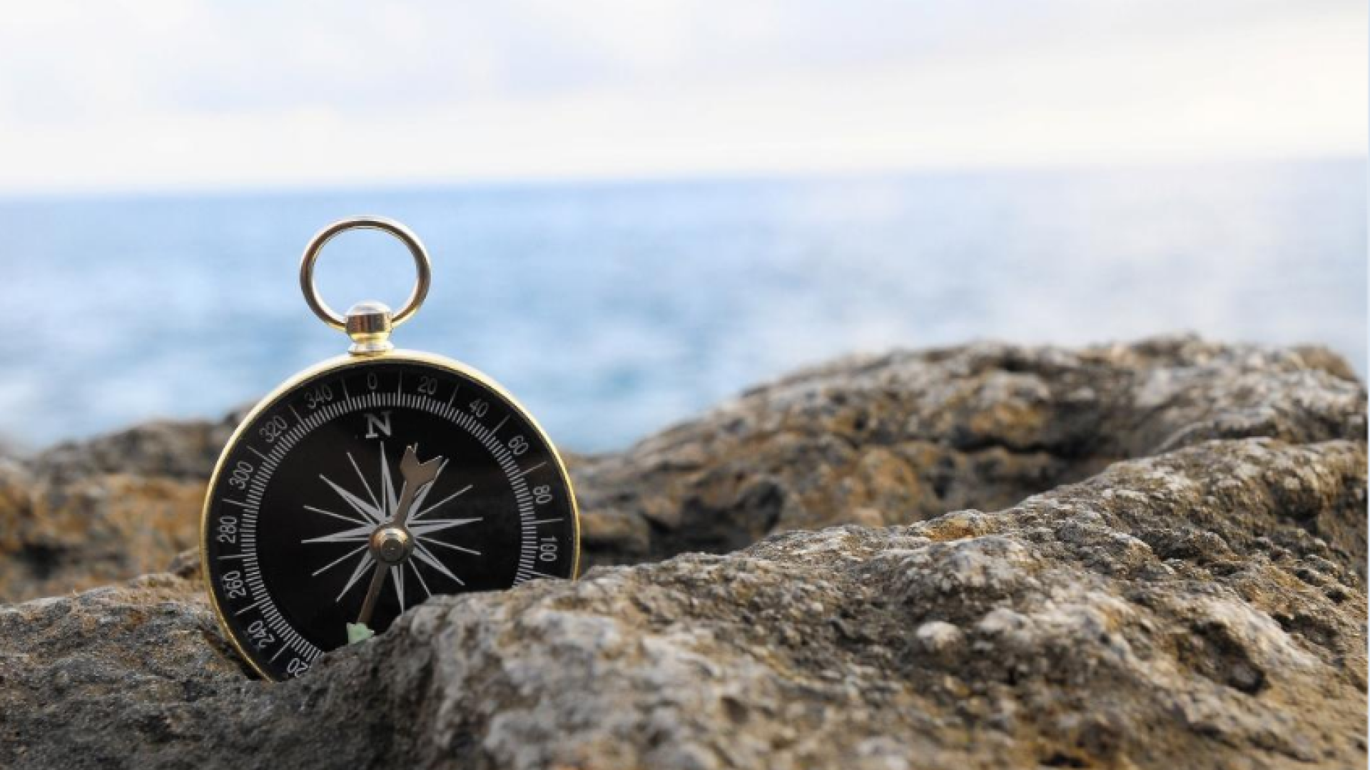 compass in sand