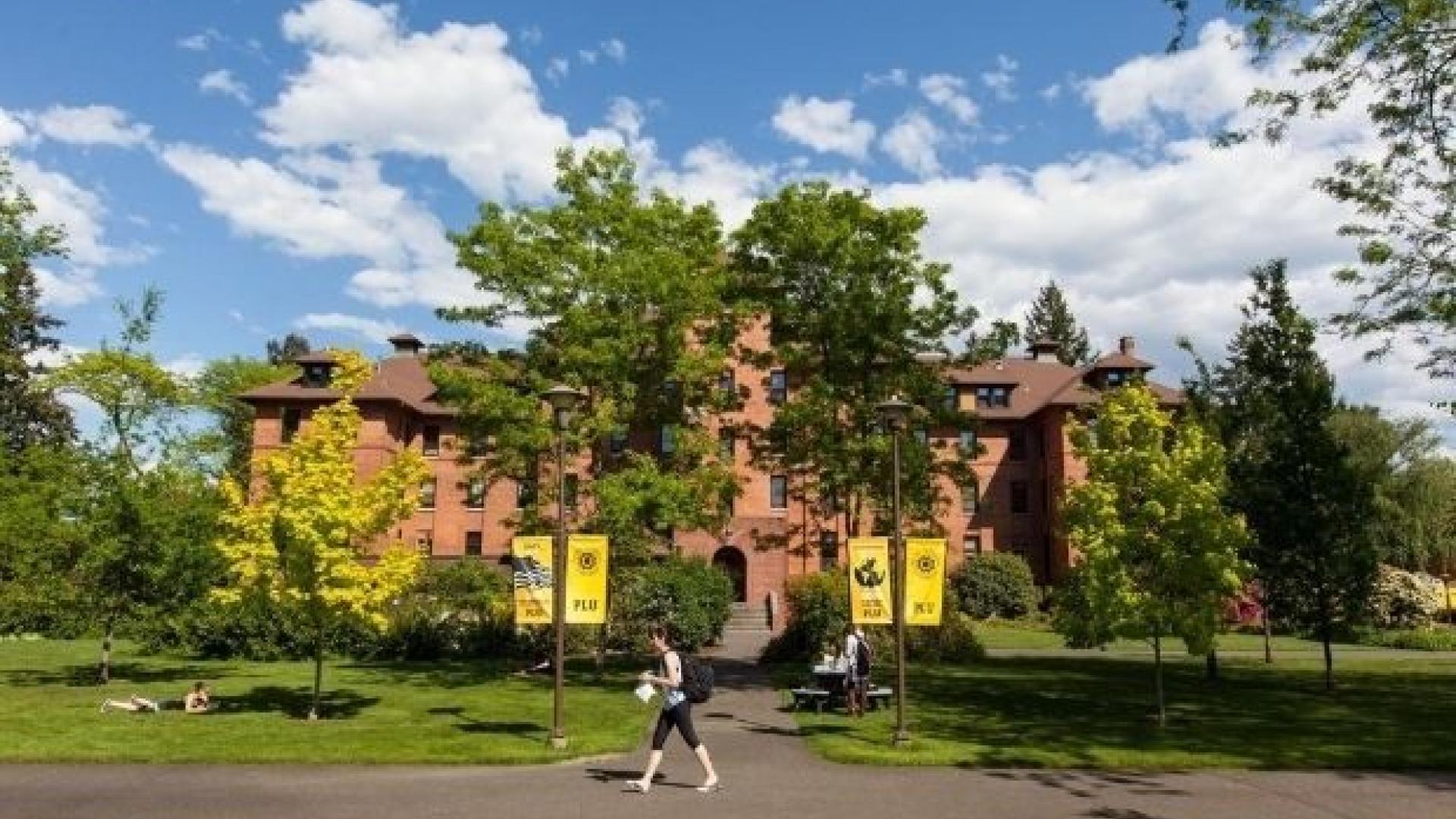 PLU campus with student walking
