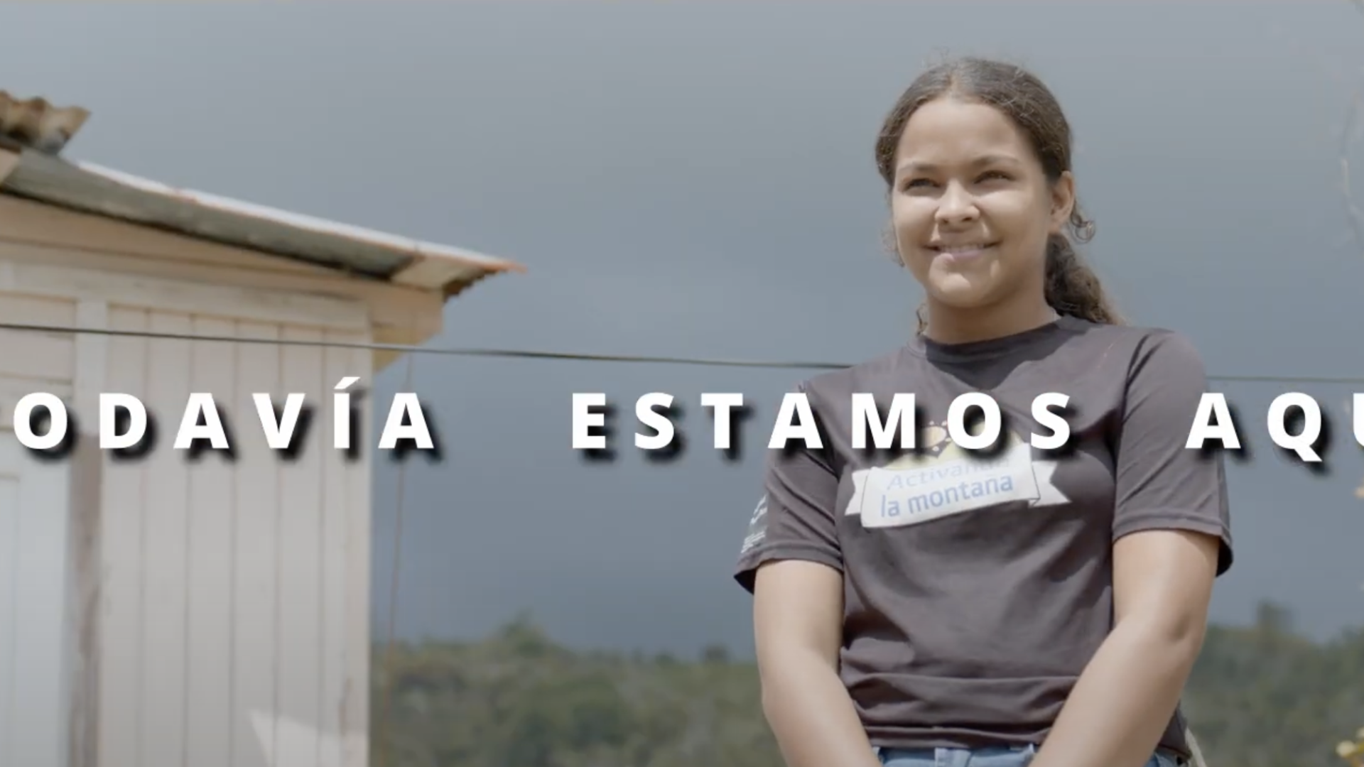 girl smiling next to white structure