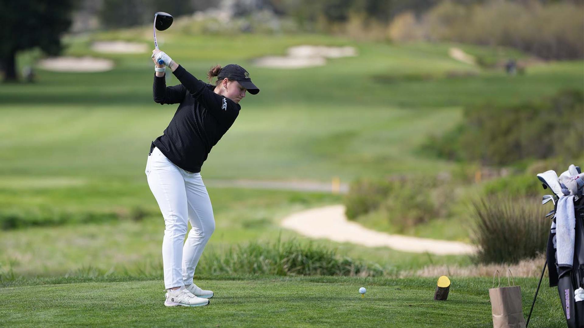 Golfer hits a shot