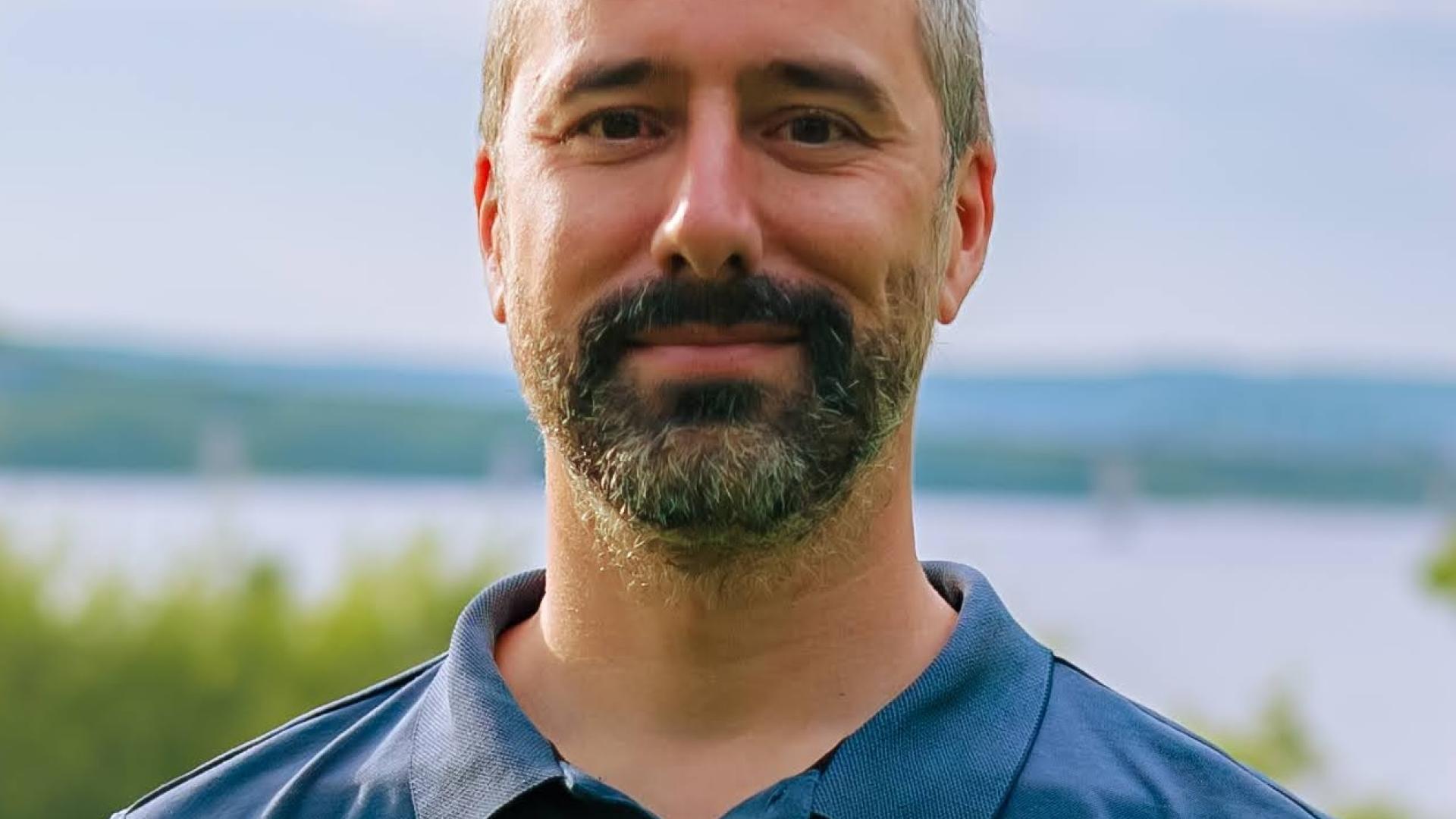 Headshot of a man outdoors