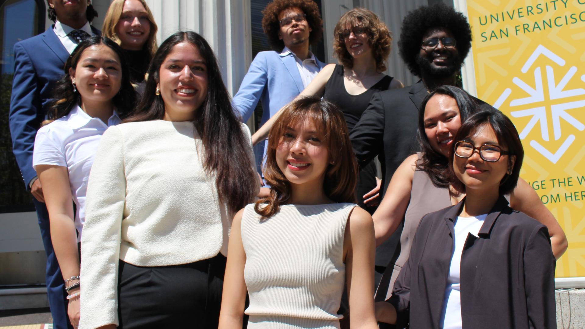 students stand in front of a building