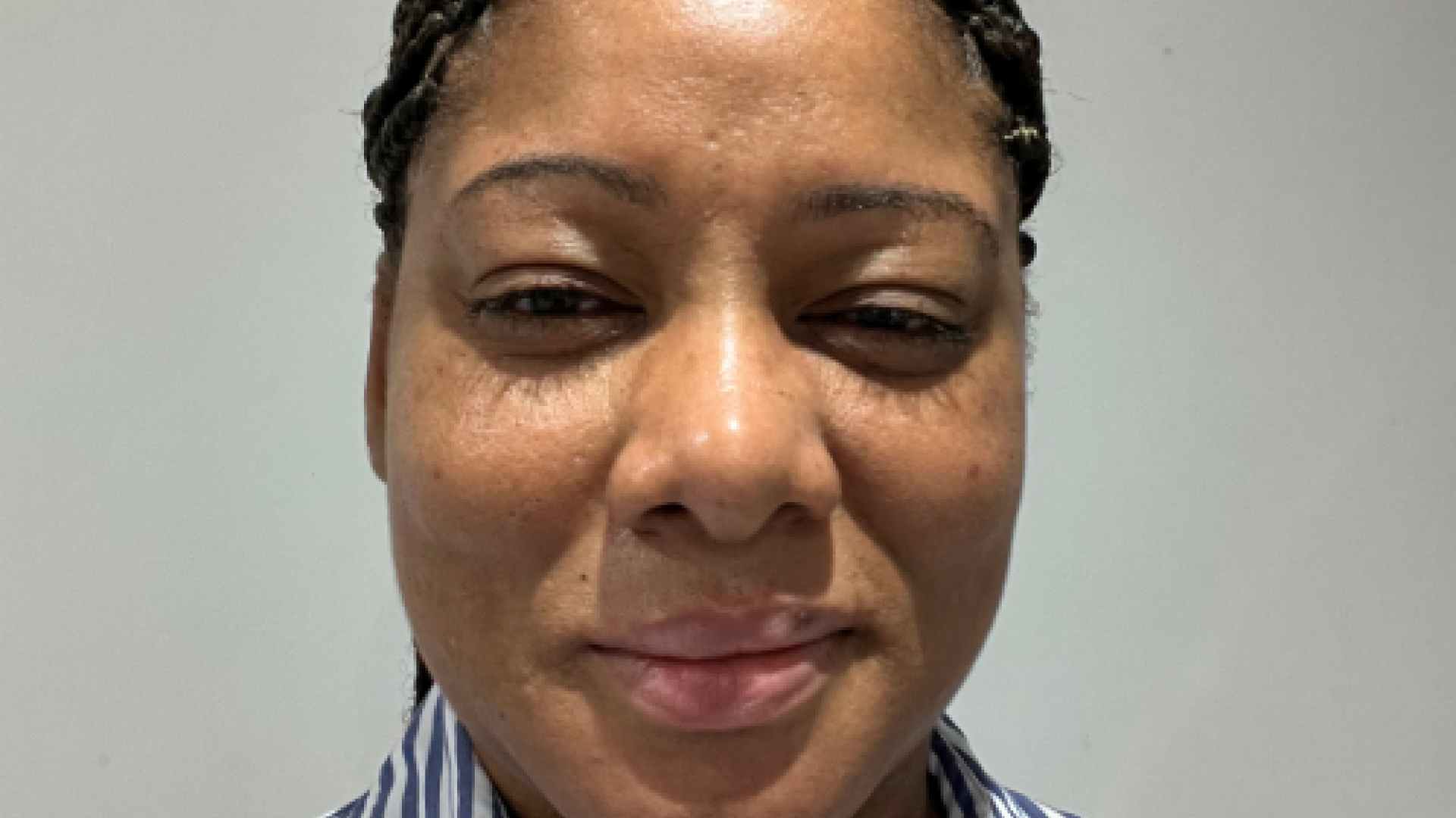 Photo of woman against grey background