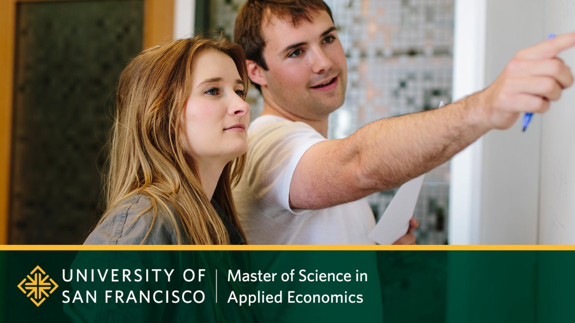 Students writing on whiteboard