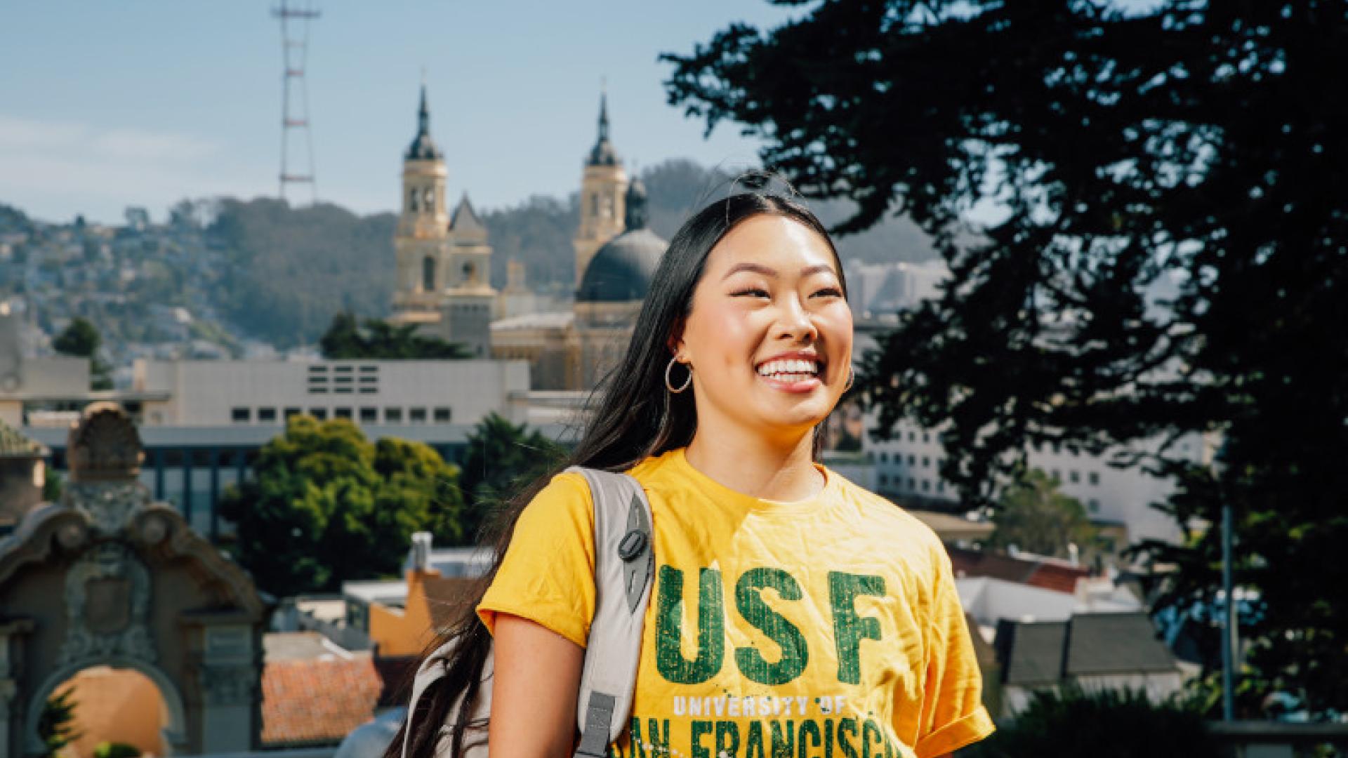 One student smiling with USF t-shirt