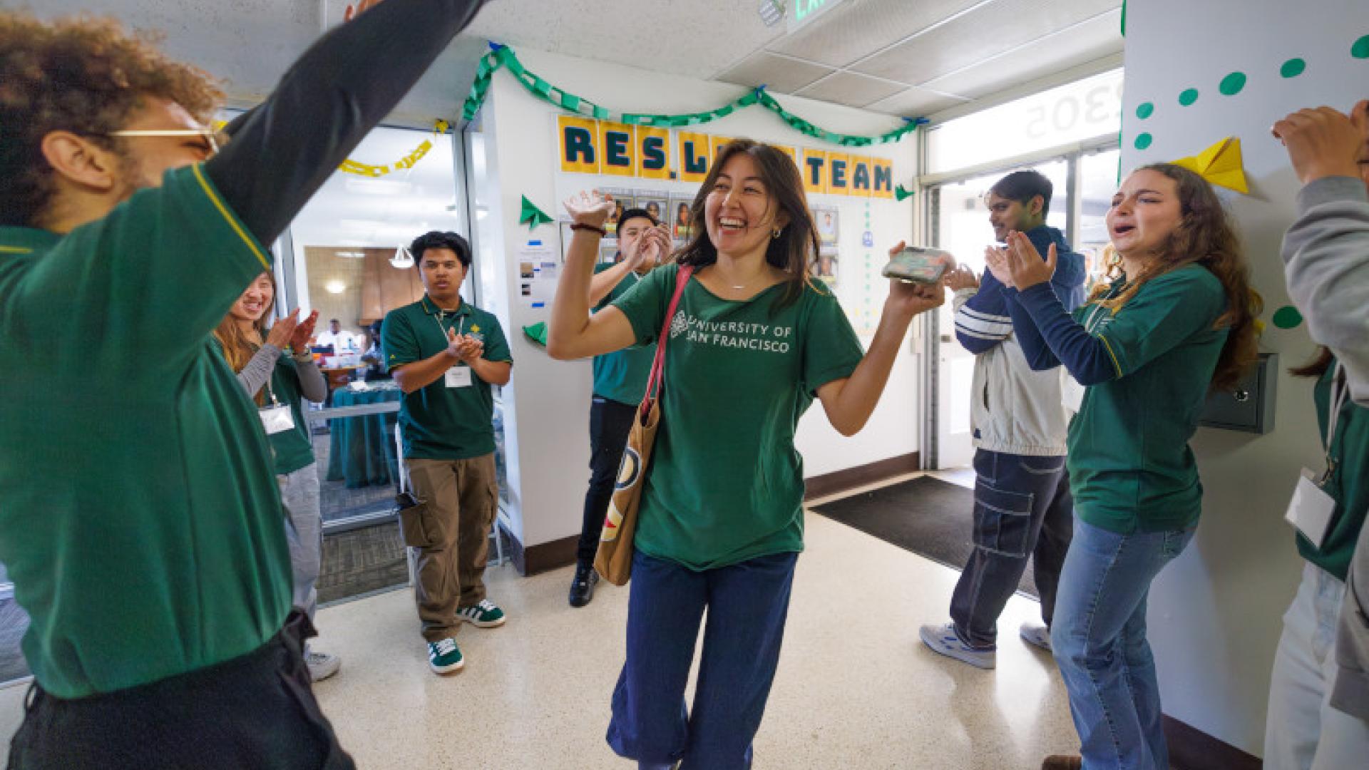 Six students cheering