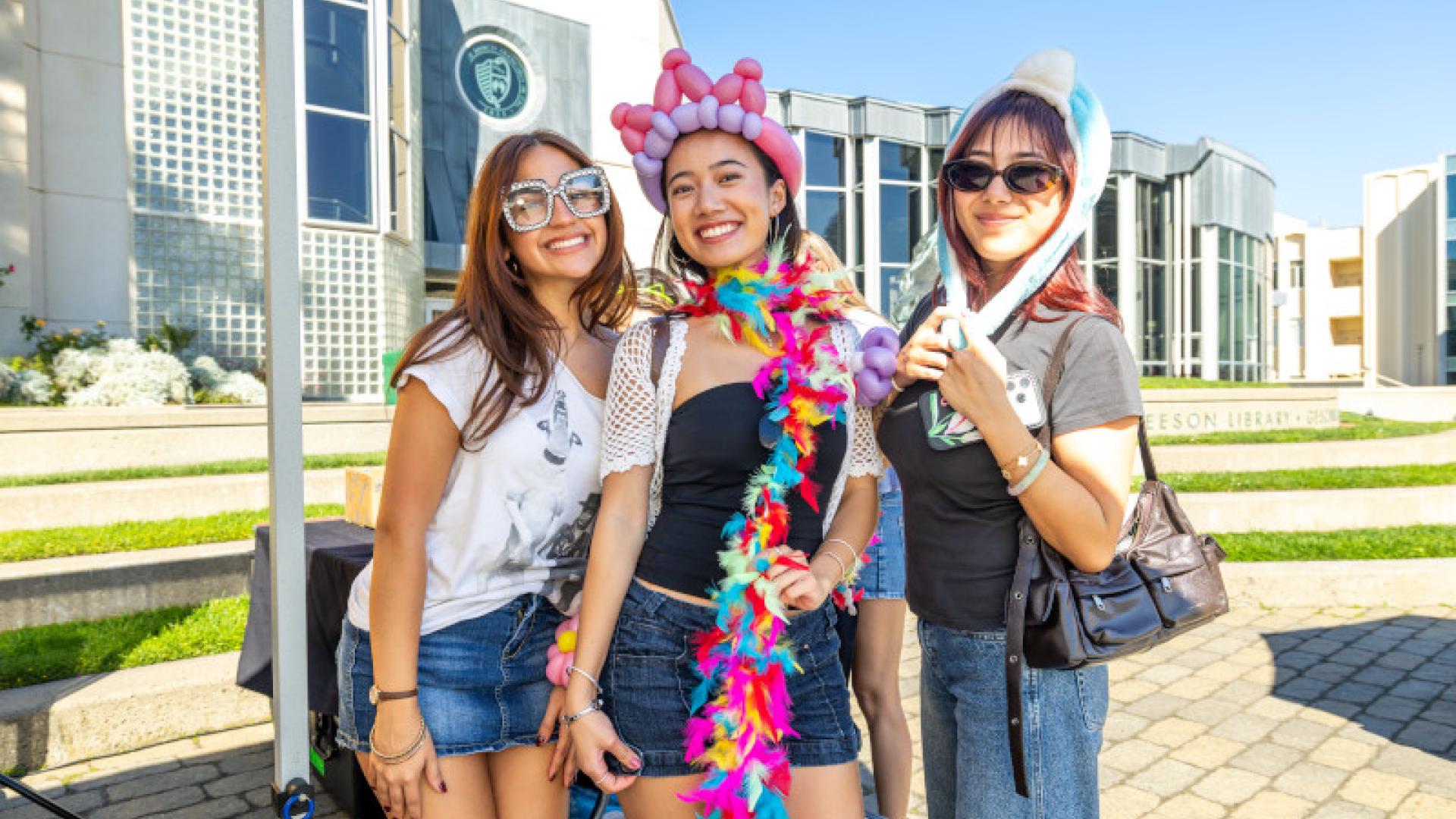 Three students together and having fun.