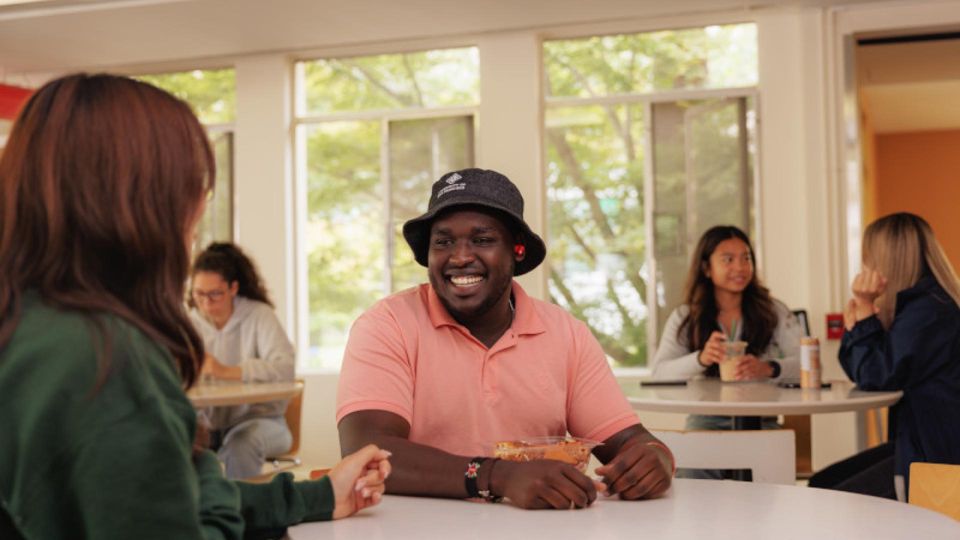 Group of students having conversations.