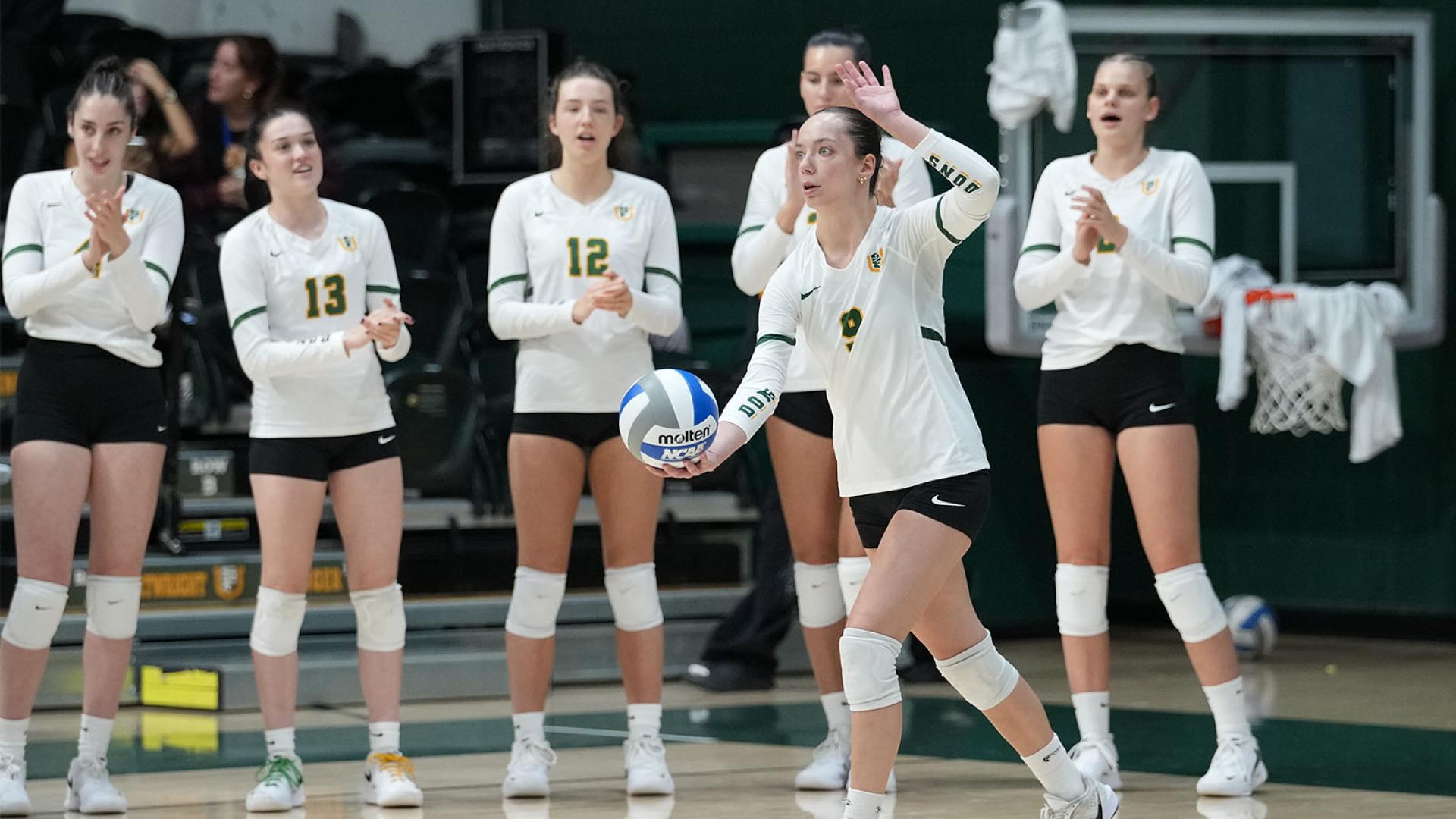 Womens volleyball player serving