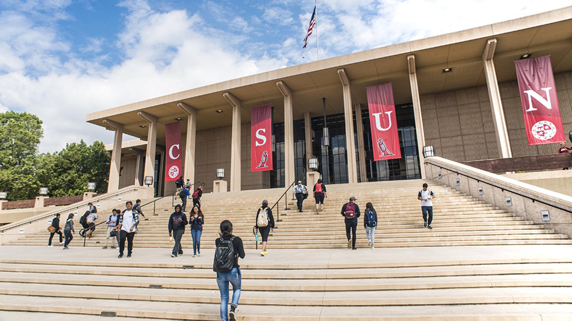 Building steps with students and banners